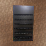 black rectangular champagne wall with flute holder shelves